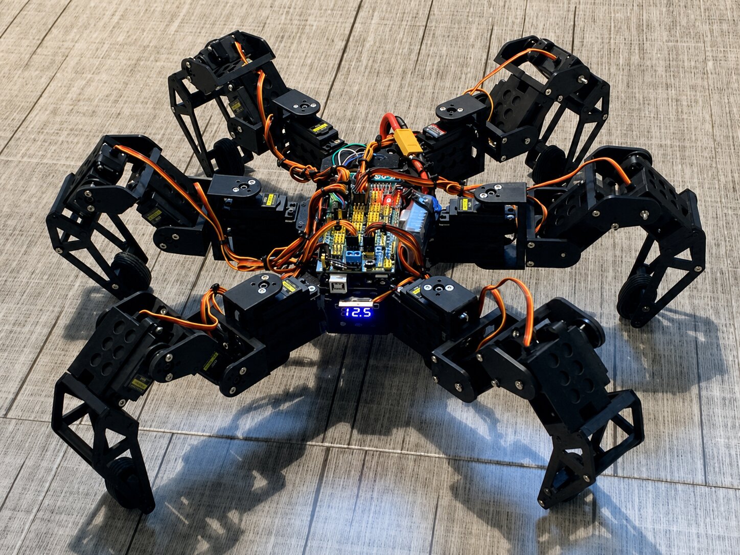 Hexapod robot close-up wiring assembly on the workbench